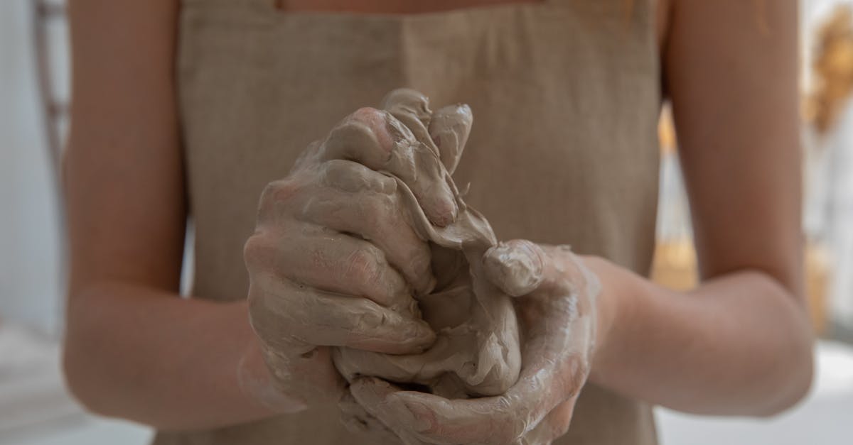 What materials do I need to make a locker? - Crop faceless woman kneading clay in workshop