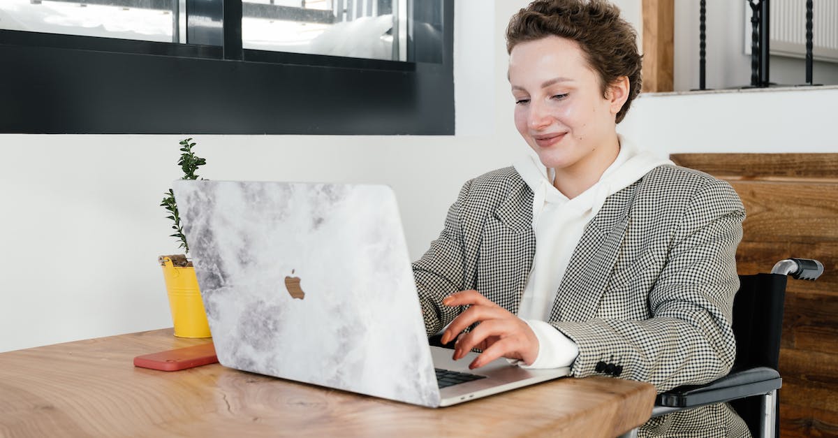 What methods are available to disable drones besides EMP gadgets? - Cheerful woman in wheelchair working on laptop in cafeteria What methods are available to disable drones besides EMP gadgets? - Cheerful woman in wheelchair working on laptop in cafeteria