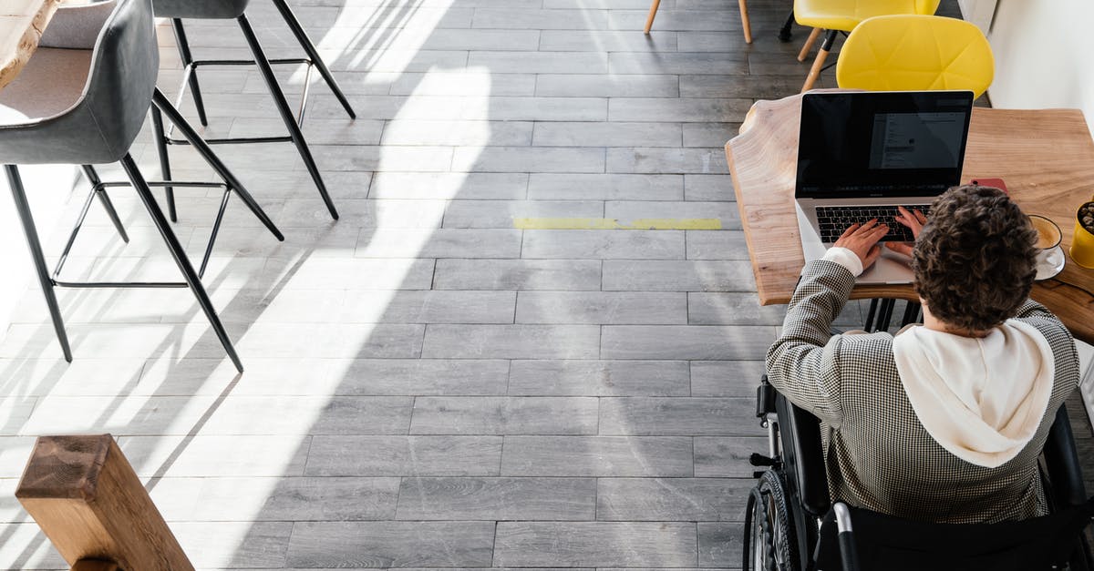 What methods are available to disable drones besides EMP gadgets? - From above of anonymous disabled female freelancer typing on netbook sitting at table while working remotely in modern spacious cafeteria What methods are available to disable drones besides EMP gadgets? - From above of anonymous disabled female freelancer typing on netbook sitting at table while working remotely in modern spacious cafeteria