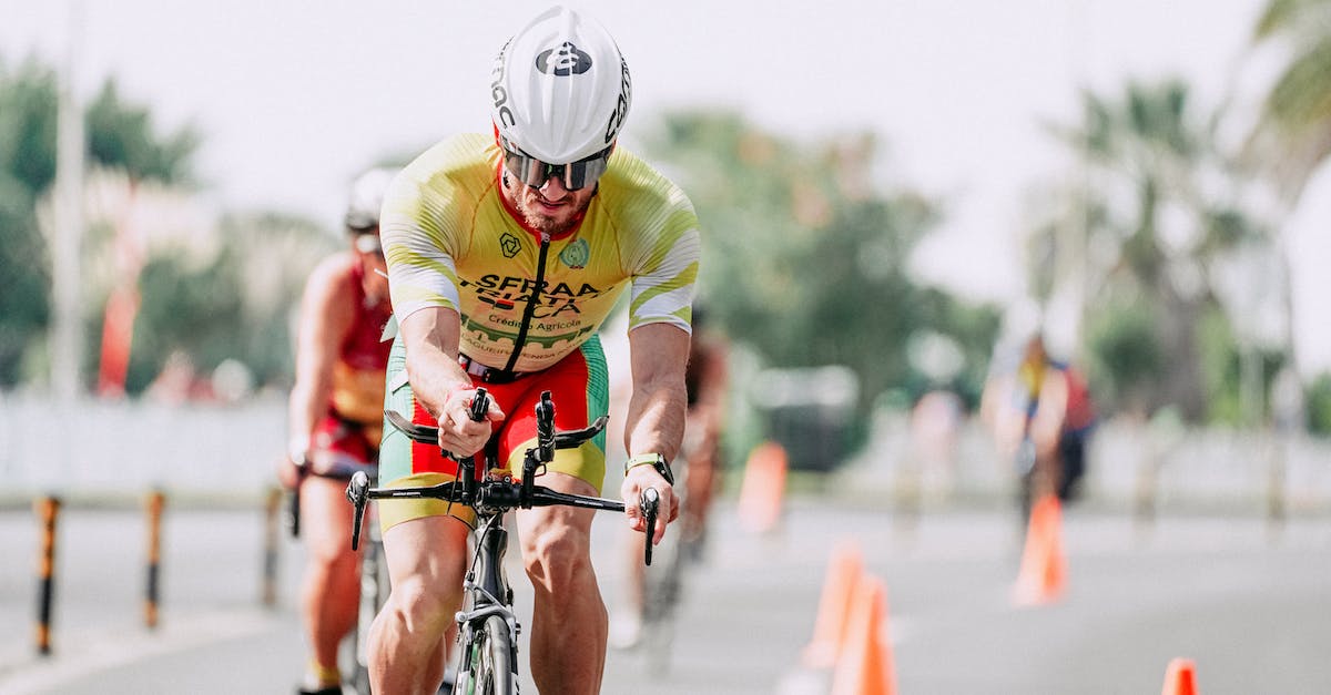 What motivates my rivals during Conquests? - Sportsman riding bike behind unrecognizable rivals during competition