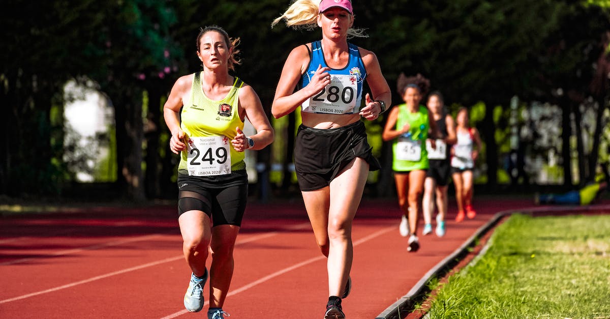What motivates my rivals during Conquests? - Young concentrated female athletes in sportswear running during track and field competition in stadium