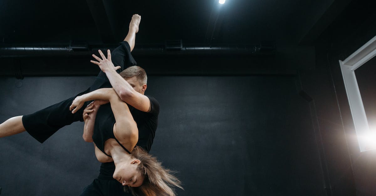 What moves can grab? - Woman in Black Tank Top and Black Pants Lying on Black Textile What moves can grab? - Woman in Black Tank Top and Black Pants Lying on Black Textile