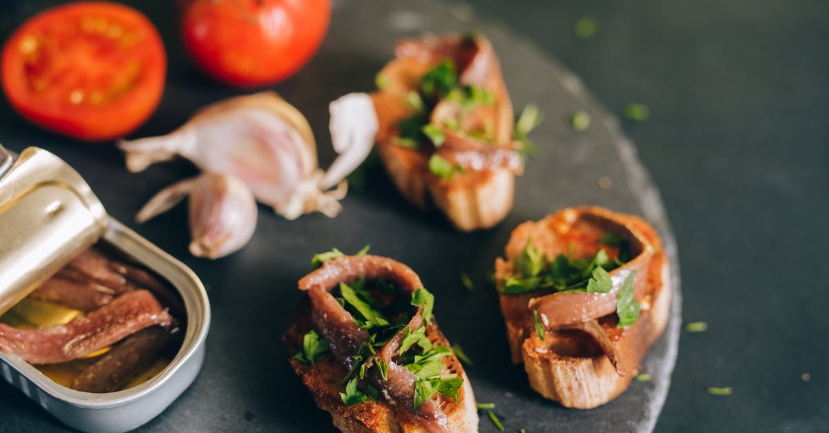 What non fish items can you get from fishing? - Photo of a Can of Anchovies Near Bread