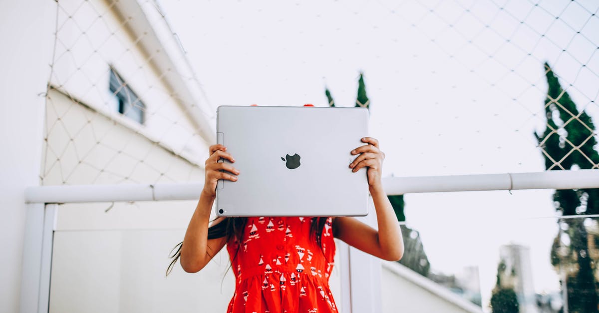 What online multiplayer features do the Half-Life games have? - Low angle of unrecognizable child in dress standing on street and covering face with modern tablet What online multiplayer features do the Half-Life games have? - Low angle of unrecognizable child in dress standing on street and covering face with modern tablet
