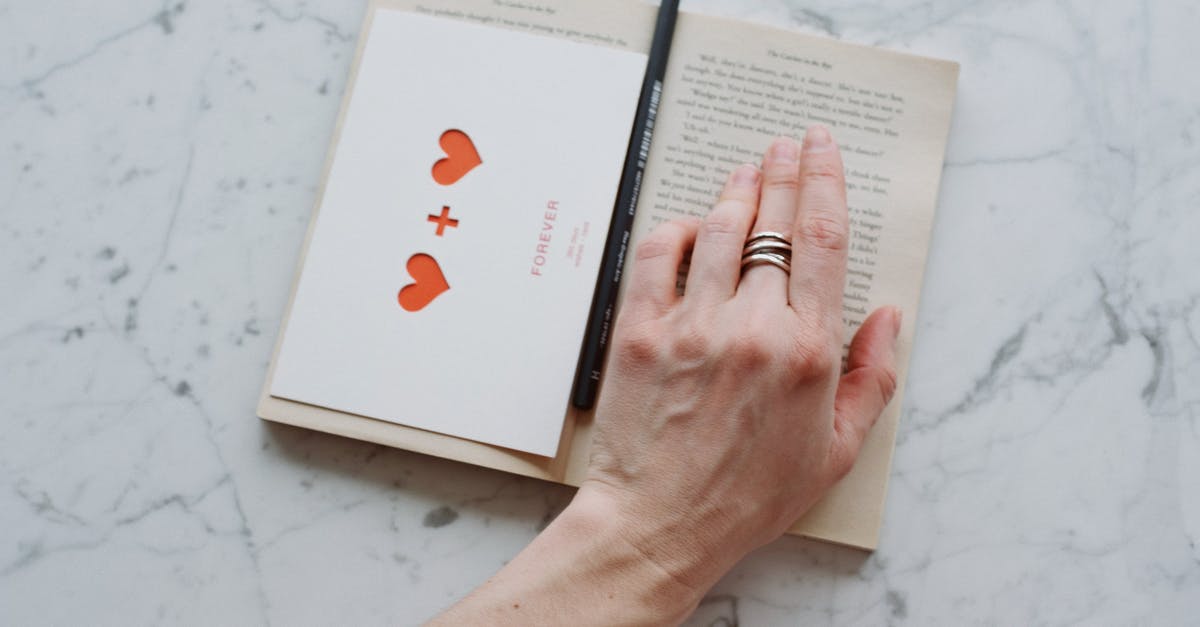 What personal story missions in Heart of Thorns require a specific mastery? - From above view of anonymous crop person reading book with romantic gift postcard and black pencil on marble table