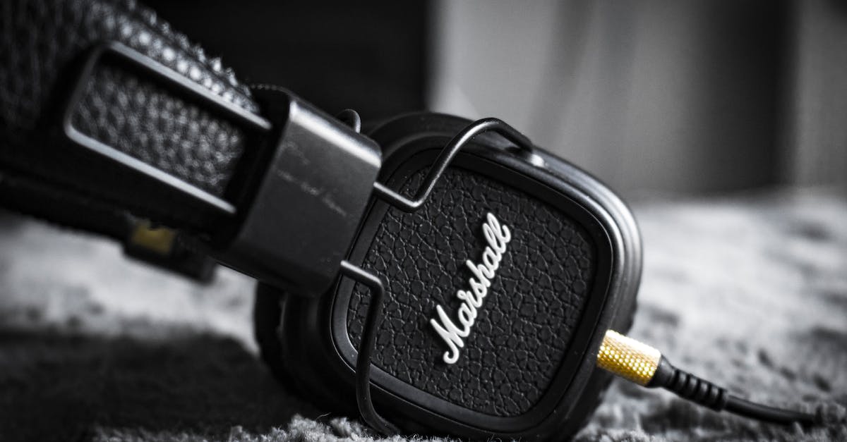 What power cord does the original playstation 3 use? - Selective Focus Photography of Marshall Corded Headphones