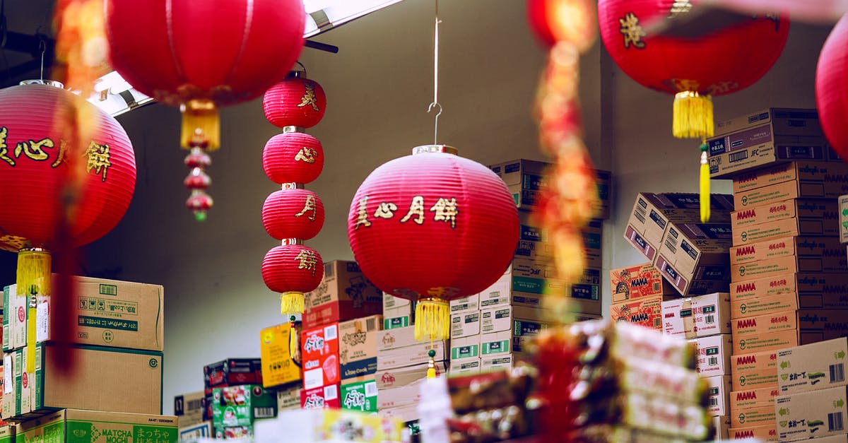What should be done when no more Pokemon can be caught? (when full storage) - Colorful Chinese lanterns hanging amidst carton boxes with food in storage on market What should be done when no more Pokemon can be caught? (when full storage) - Colorful Chinese lanterns hanging amidst carton boxes with food in storage on market
