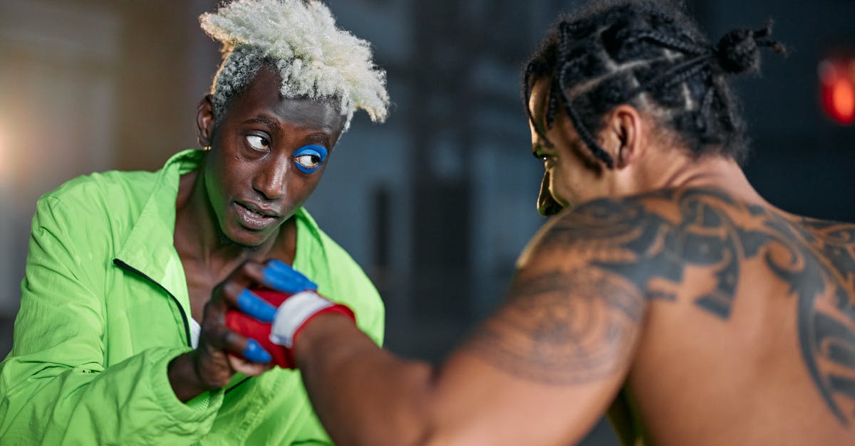 What specific types of Chinese Martial arts Does Ling Xiaoyu use in the Tekken series? - Man in Green Fighting a Tattooed Man Without Shirt