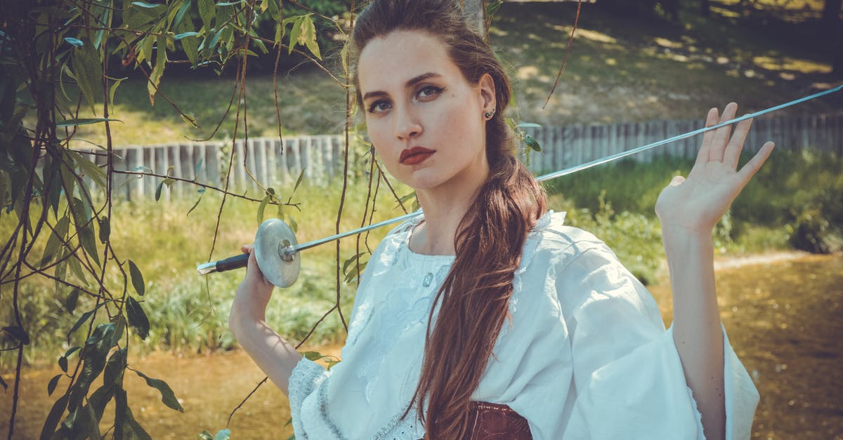What sword does Lady Hoteshem have in WoW? - Serious young female with long hair in vintage clothes standing in yard of village house with fencing sword in hand What sword does Lady Hoteshem have in WoW? - Serious young female with long hair in vintage clothes standing in yard of village house with fencing sword in hand