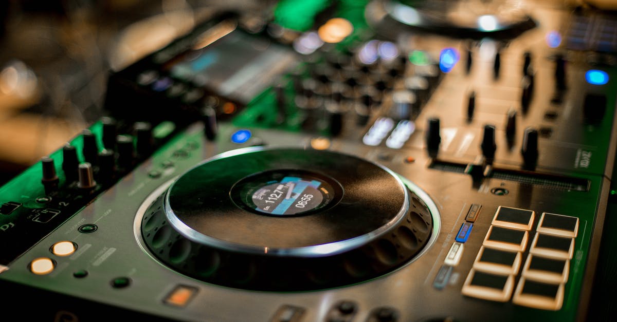 What system is this controller for? - Selective focus of glowing music controller for music mixing and turntables on console What system is this controller for? - Selective focus of glowing music controller for music mixing and turntables on console