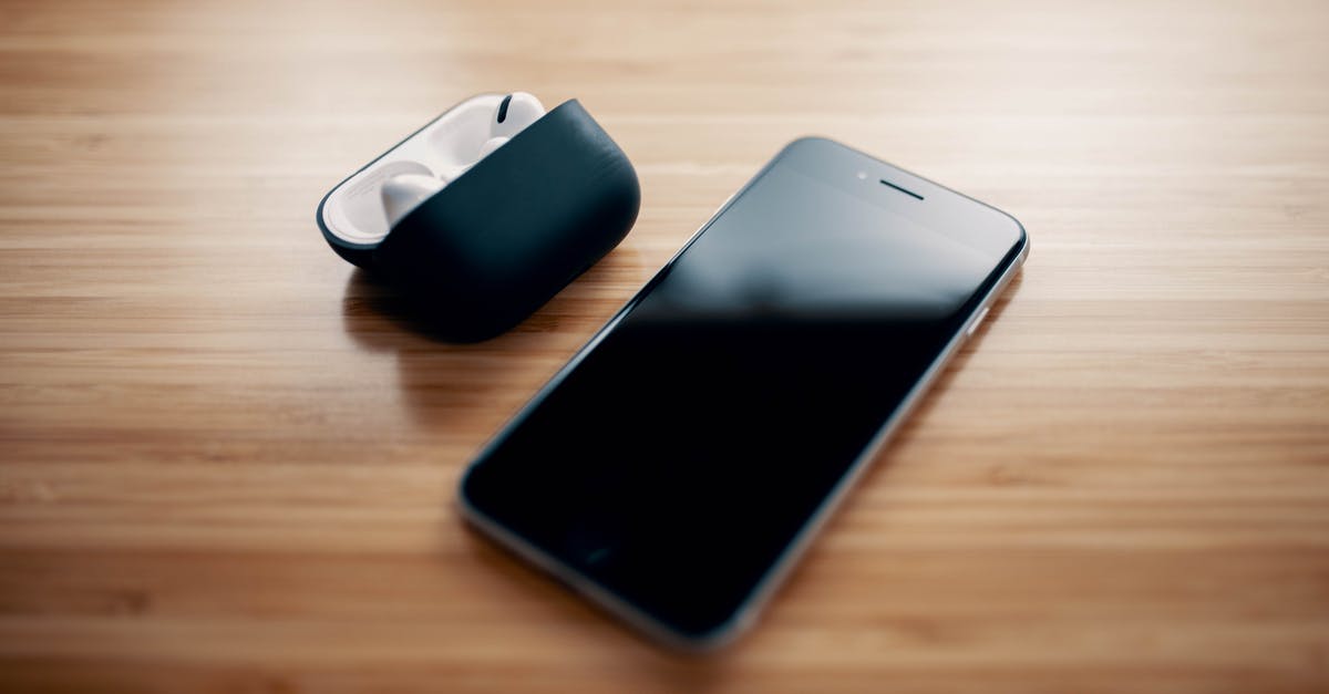 What t2 equipment can the new alpha clones use? - Black smartphone and true wireless earphones on table on table What t2 equipment can the new alpha clones use? - Black smartphone and true wireless earphones on table on table