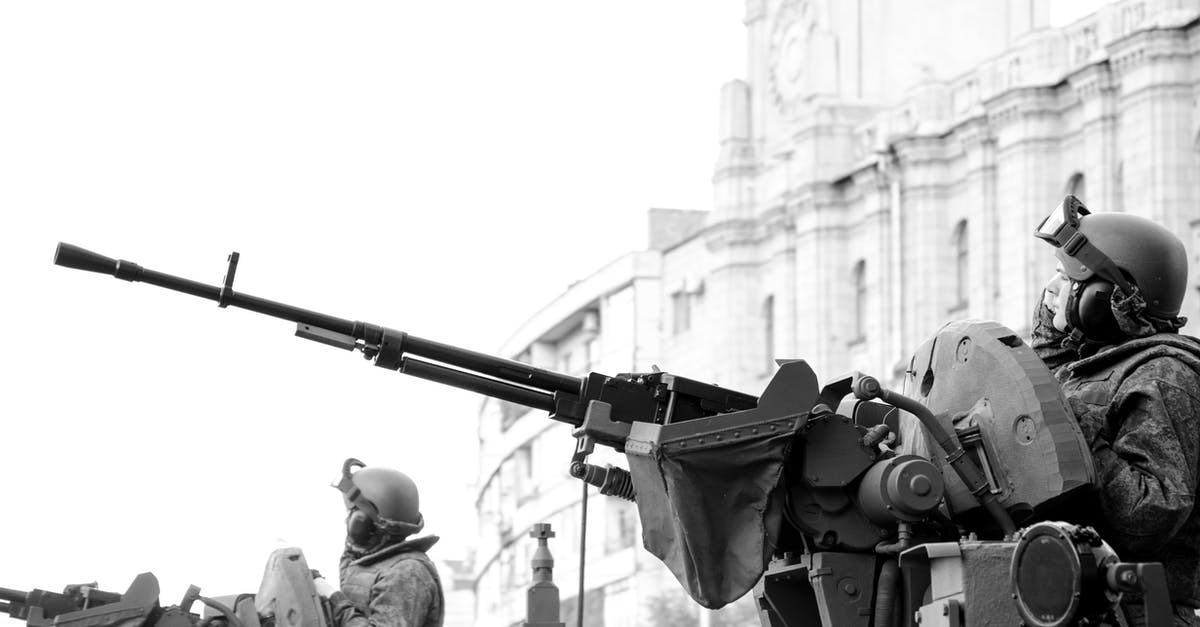 What tanks have the most FOV? - Grayscale Photo of Man Holding Rifle