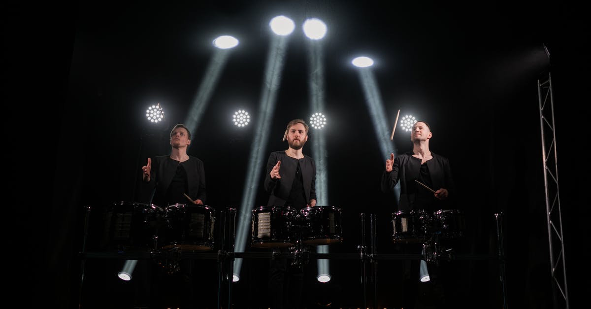 What to do when you live too far from civilization? [duplicate] - Young artists playing drums on stage during show