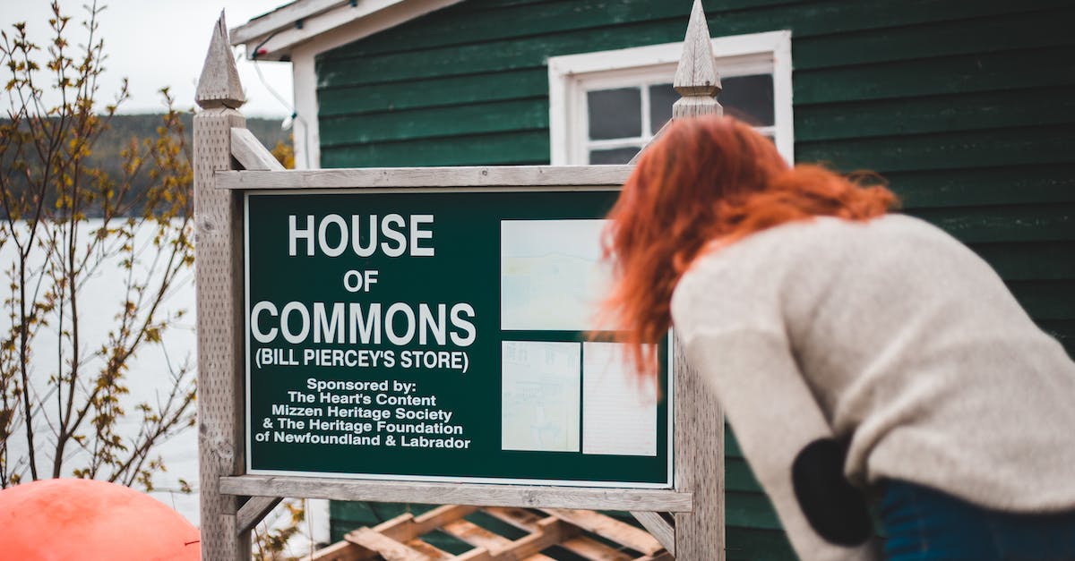 What to do with my Common Data Crystals? - Back view unrecognizable female wearing casual clothes bending down and reading information on signpost with inscription House of Commons placed outside small rural house What to do with my Common Data Crystals? - Back view unrecognizable female wearing casual clothes bending down and reading information on signpost with inscription House of Commons placed outside small rural house