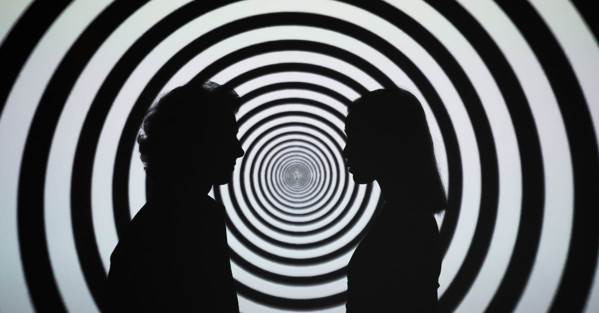 What triggers the hallucinations (or are they random)? - Silhouette of 2 Person Standing in Front of White and Black Stripe Wall