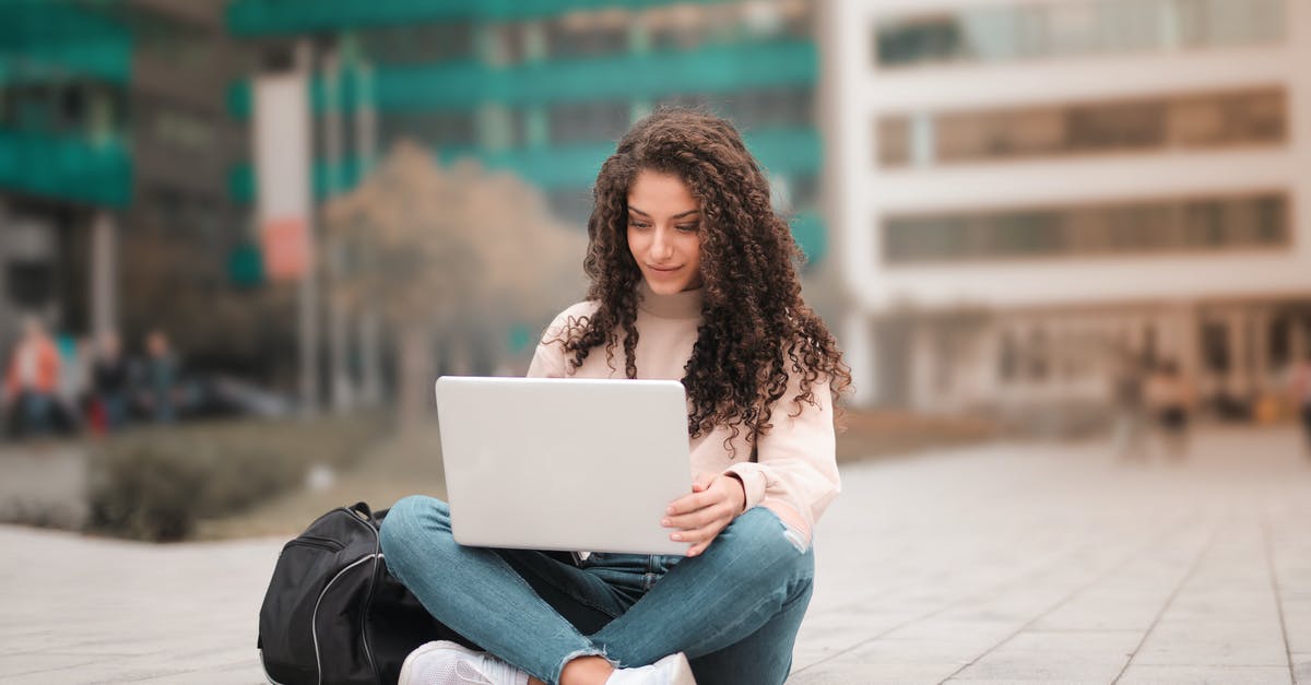 What type of buildings offer what level of jobs? - Woman in Pink Sweater Using Laptop What type of buildings offer what level of jobs? - Woman in Pink Sweater Using Laptop