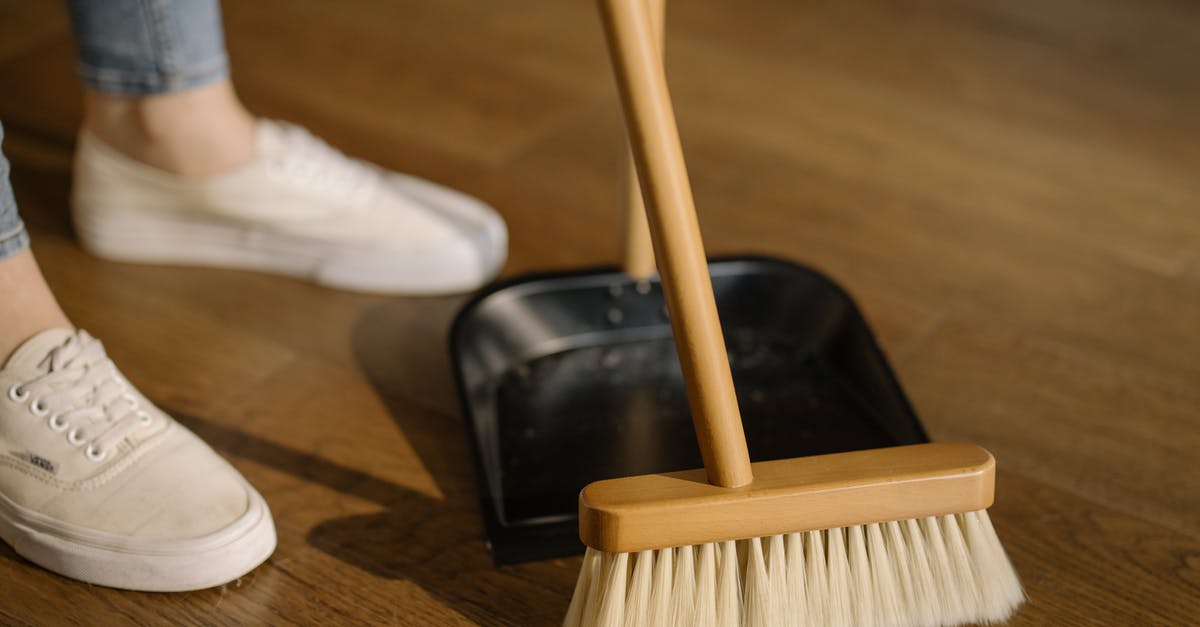 What value is there in keeping multiples of the same mirage? - Person Wearing White Pants and White Socks Standing Beside Brown Broom