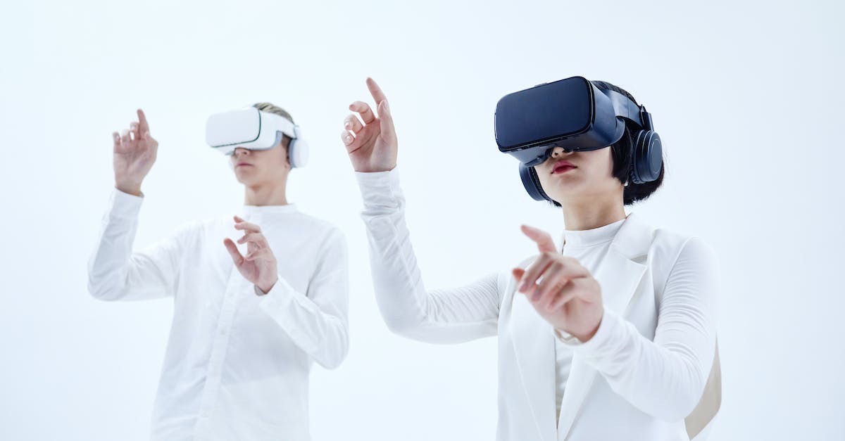 What Warframe quests are there? - Man and Woman in White Long Sleeves Wearing Virtual Reality Headsets 