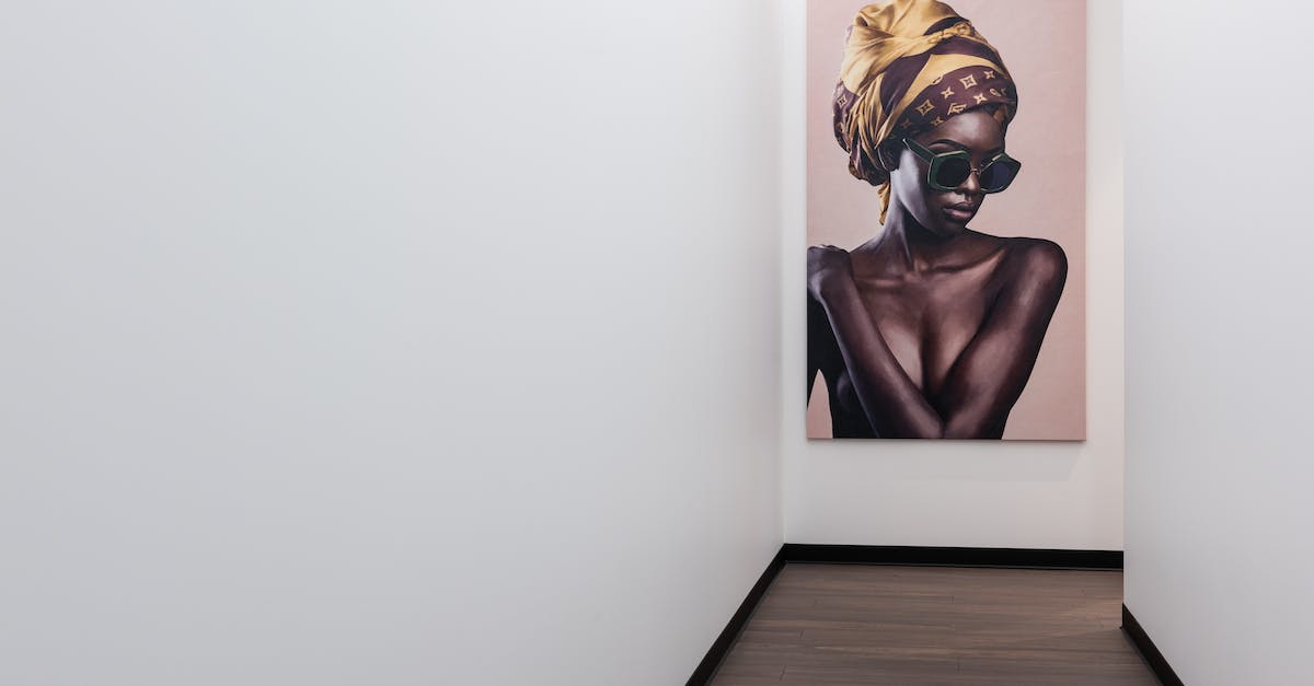 What was New World Computing's "Hall of Heroes"? - Interior if empty hallway with colorful poster on white wall and parquet floor