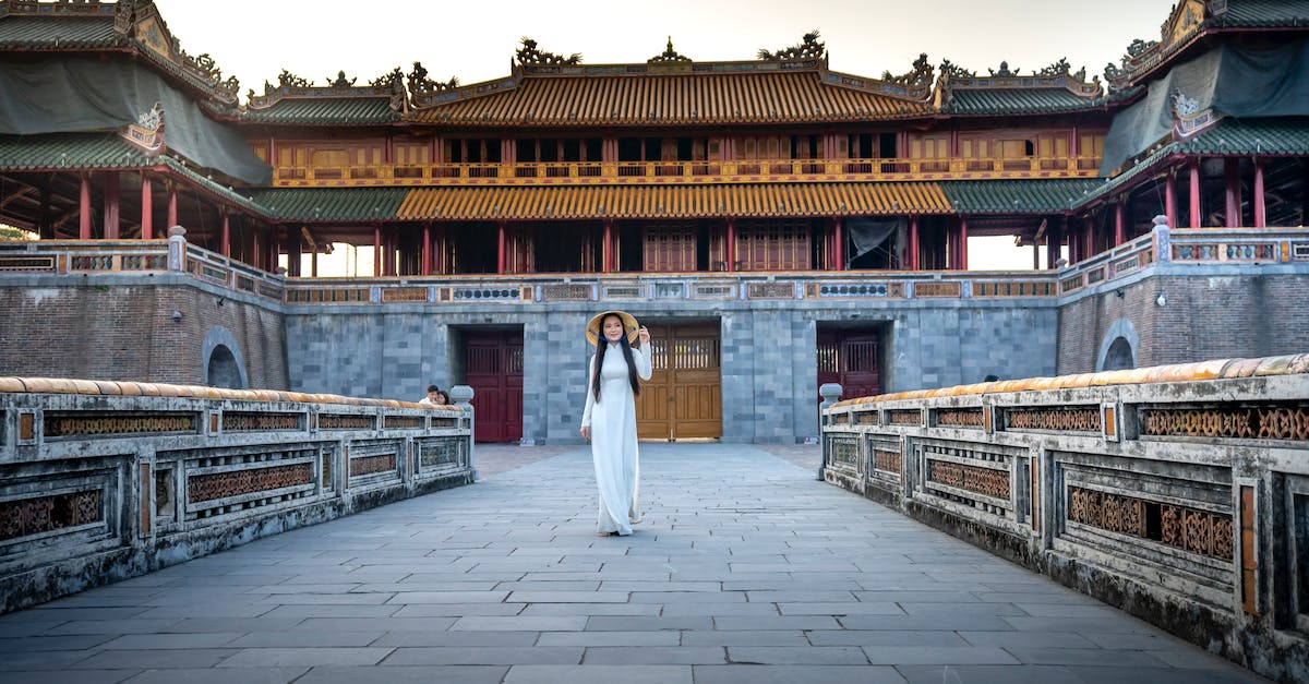 What was the the original level cap on Baldur's Gate 2? - Full body of ethnic female wearing traditional bamboo hat standing against aged oriental shrine in authentic town What was the the original level cap on Baldur's Gate 2? - Full body of ethnic female wearing traditional bamboo hat standing against aged oriental shrine in authentic town