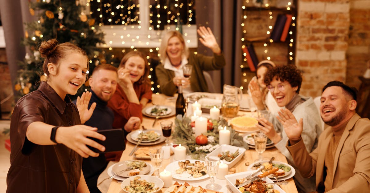 What year does Portal and its sequel, Portal 2, take place in? - Family Celebrating Christmas Dinner While Taking Selfie