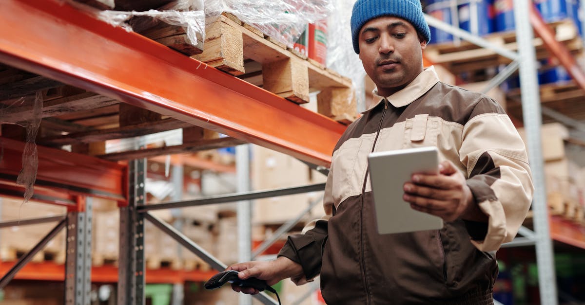 Whats the difference between Depot and Warehouse? - Man Holding Digital Tablet Whats the difference between Depot and Warehouse? - Man Holding Digital Tablet