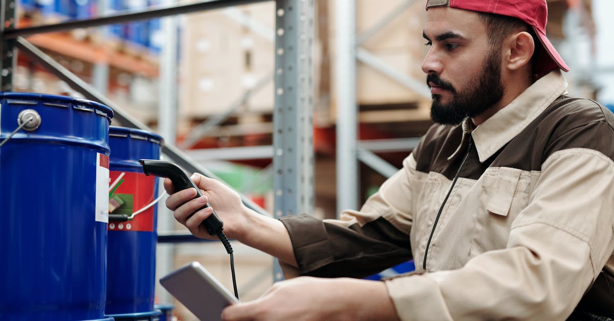 Whats the difference between Depot and Warehouse? - Photo of Man Using Scanner Whats the difference between Depot and Warehouse? - Photo of Man Using Scanner