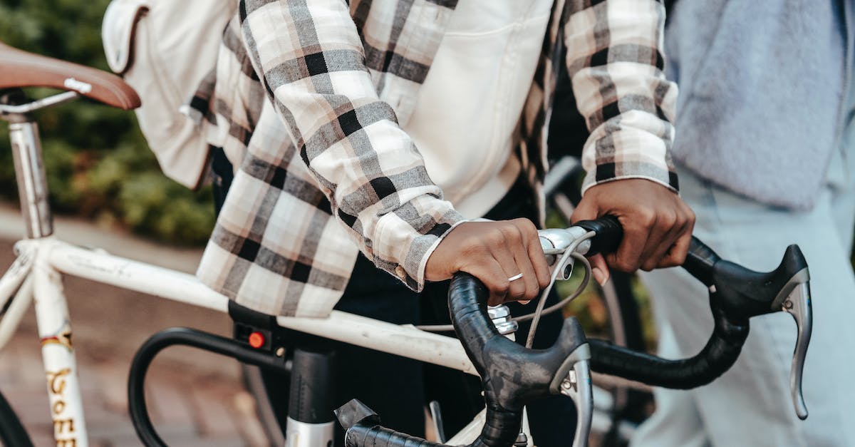 Whats the time cycle for the campsite? - Black woman with bicycle in park with friend