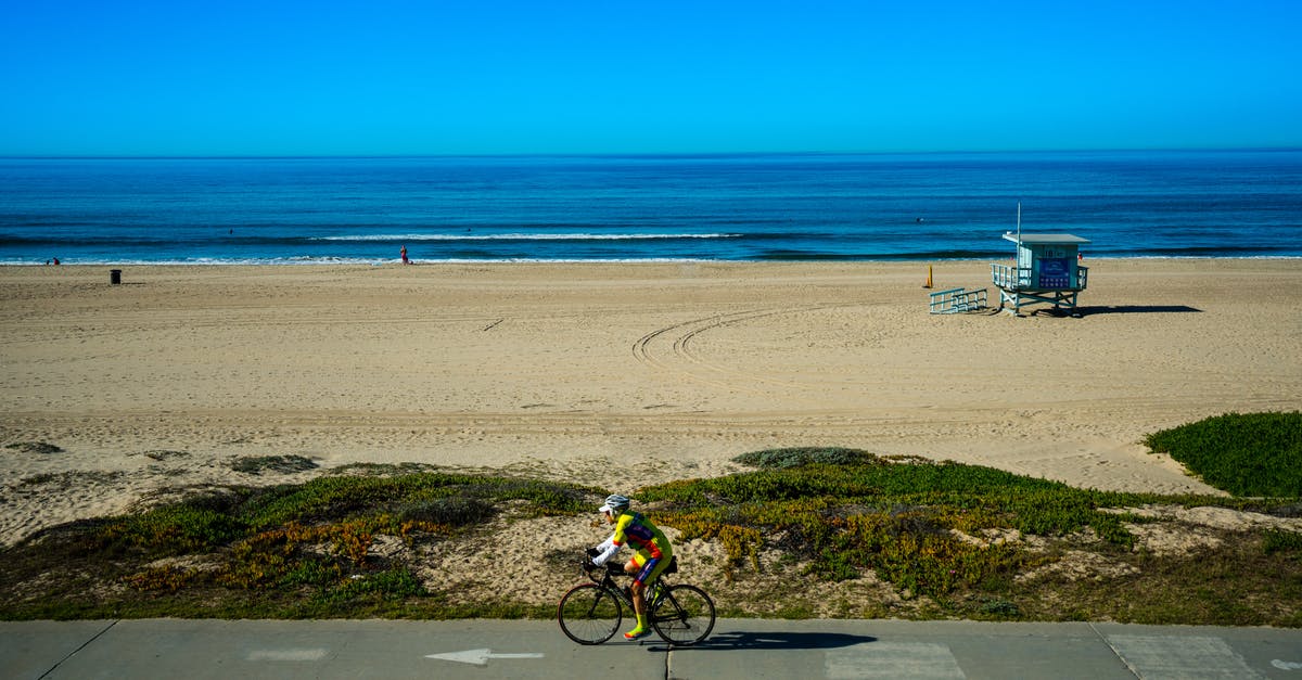 Whats the time cycle for the campsite? - Lonely cyclist riding bike near seashore