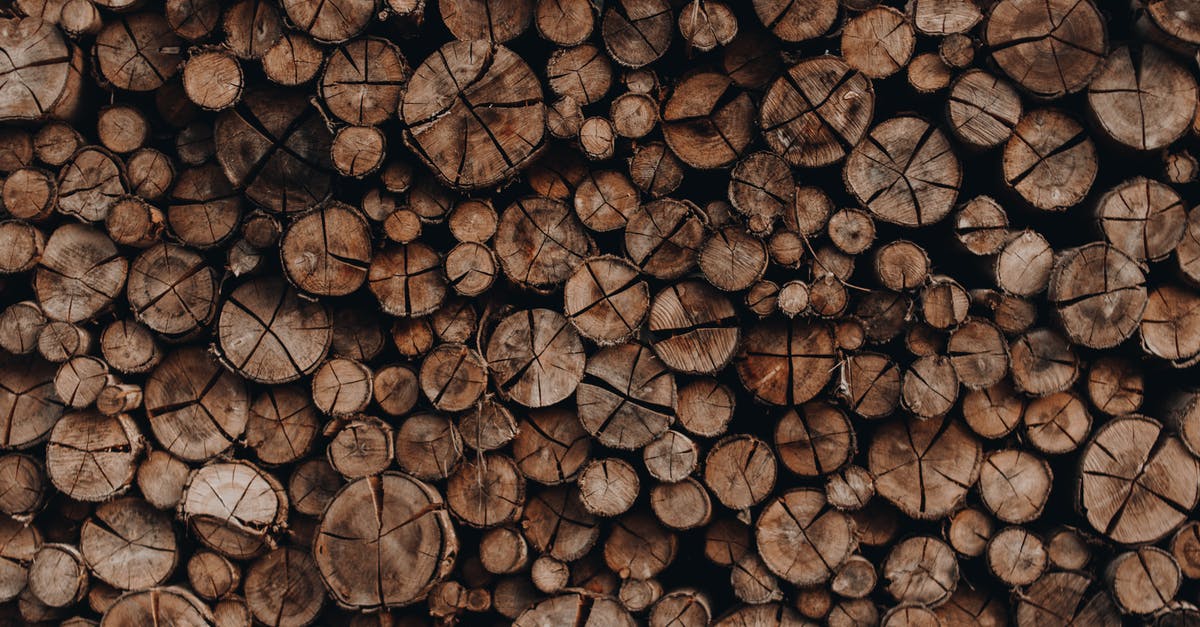 When am I ready for sunglasses? - Pile of wooden skids with cracks stacked accurately in rows arranged for cutting When am I ready for sunglasses? - Pile of wooden skids with cracks stacked accurately in rows arranged for cutting