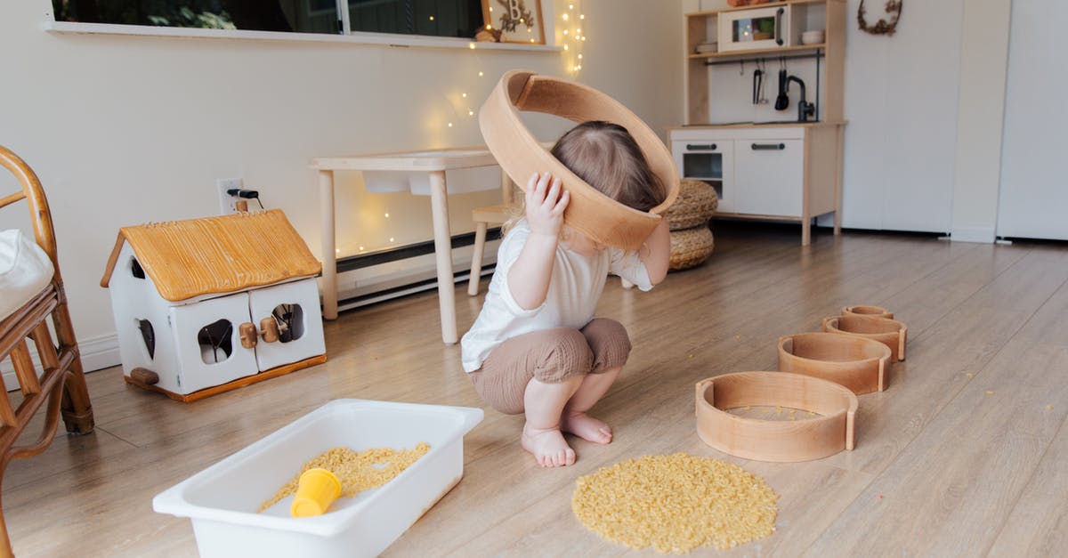When breaking honeyfruit, how long does the health packs last? - Full length of anonymous toddler squatting barefoot on floor playing with round wooden shapes of different size and pasta and putting biggest shape on while developing fine motor skills at home