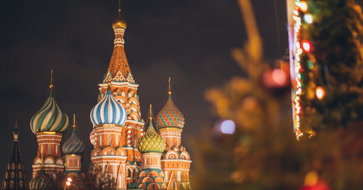 When do citizens of a new city adopt a religion? - Famous Cathedral of Vasily Blessed on Red Square against dark cloudy evening sky during Christmas holidays in Russian Federation