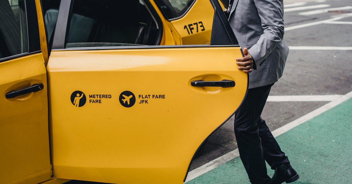 When do other areas of town open up? - Crop faceless black man opening taxi door