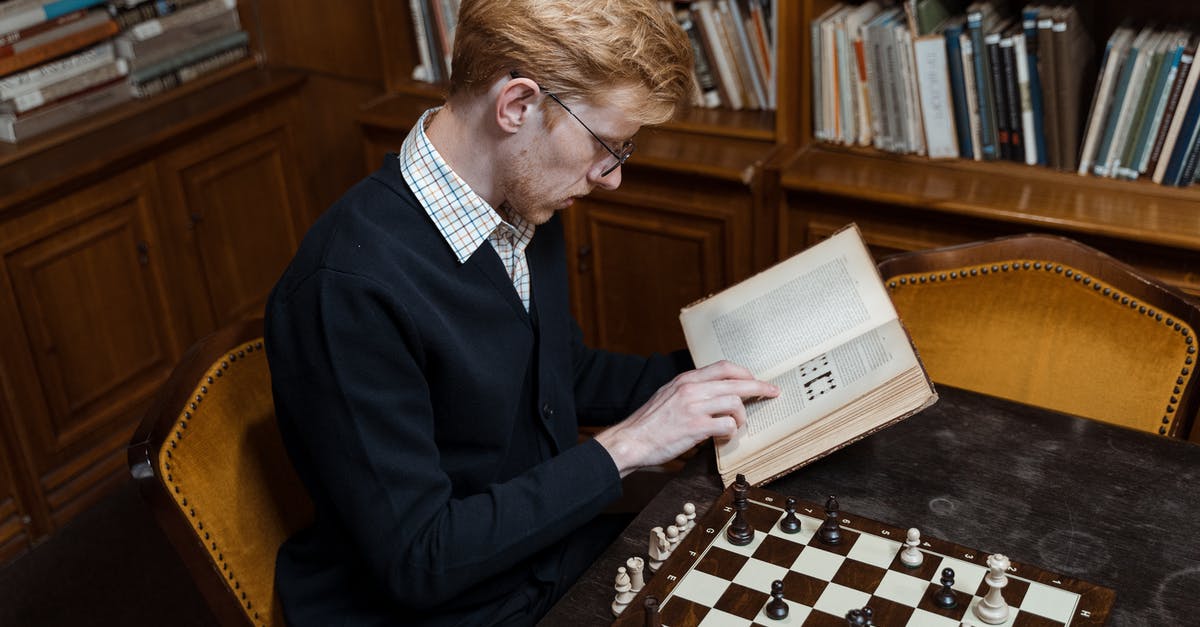 When do the books and the games diverge? - A Man Reading a Book Inside the Library When do the books and the games diverge? - A Man Reading a Book Inside the Library