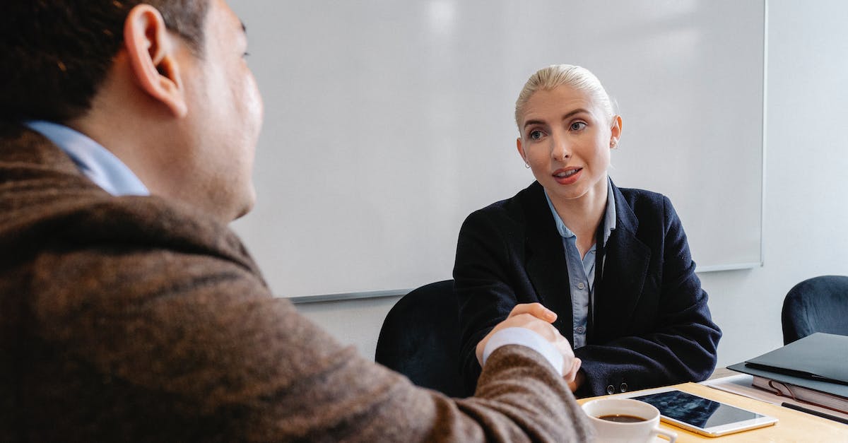 When does each boss theme play? - Multiracial colleagues shaking hands in office