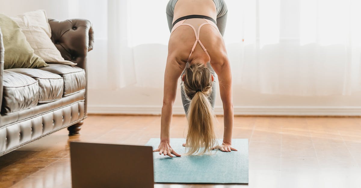 When exactly does the RDO tutorial end? - Full body of unrecognizable female in activewear performing standing forward bend asana while standing on mat near laptop during online yoga lesson at home