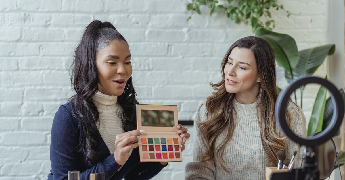 When exactly does the RDO tutorial end? - Young diverse ladies recording vlog about makeup products on smartphone