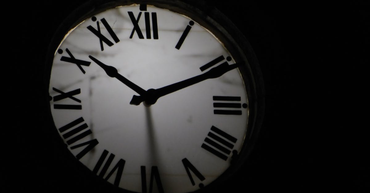 When I enter the Institute for the first time I can't progress - Round mechanical clock with black arrows and numbers on white face ticking on black background in darkness