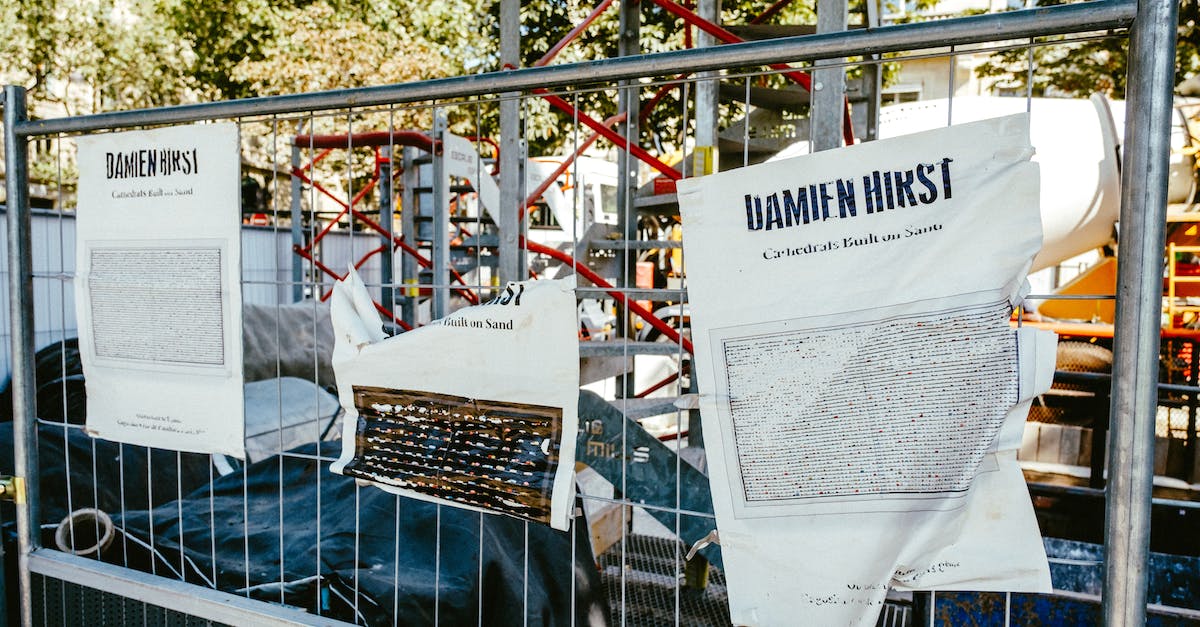 When is information transmitted in a Streetpass? - White and Black Poster on Metal Fence