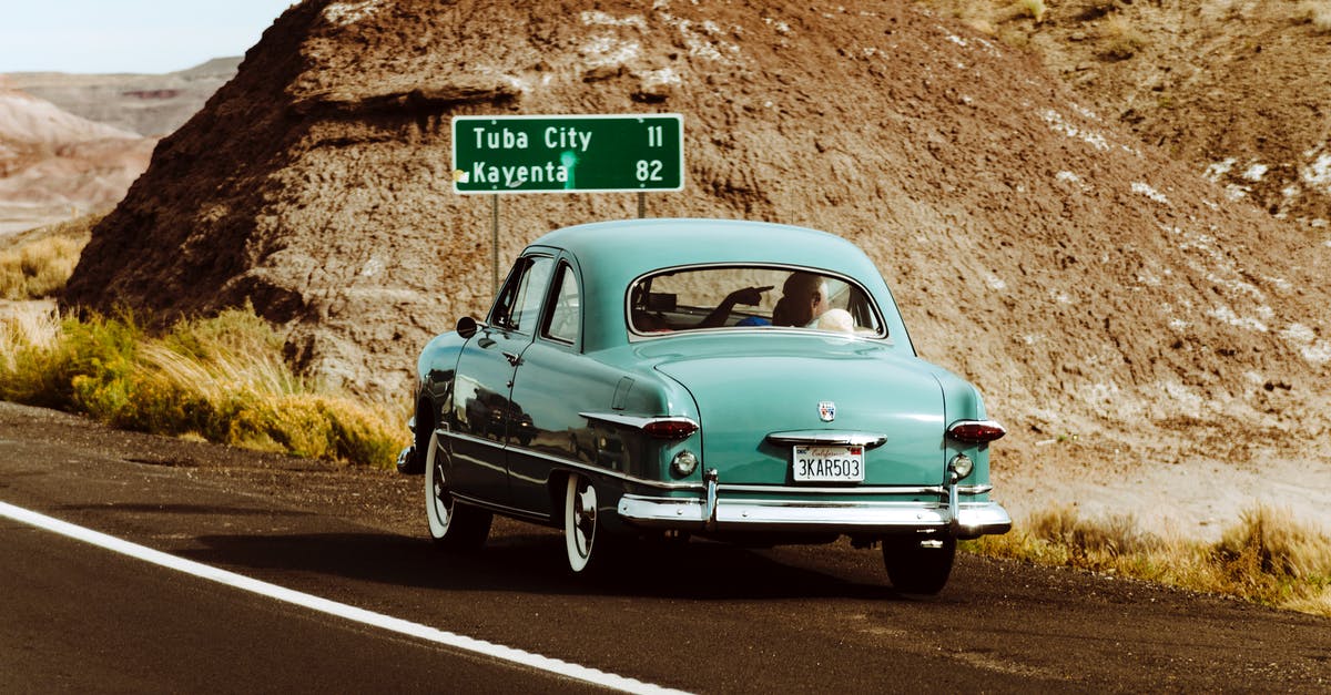 When is it possible to travel to the Americas? - Teal Volkswagen Beetle