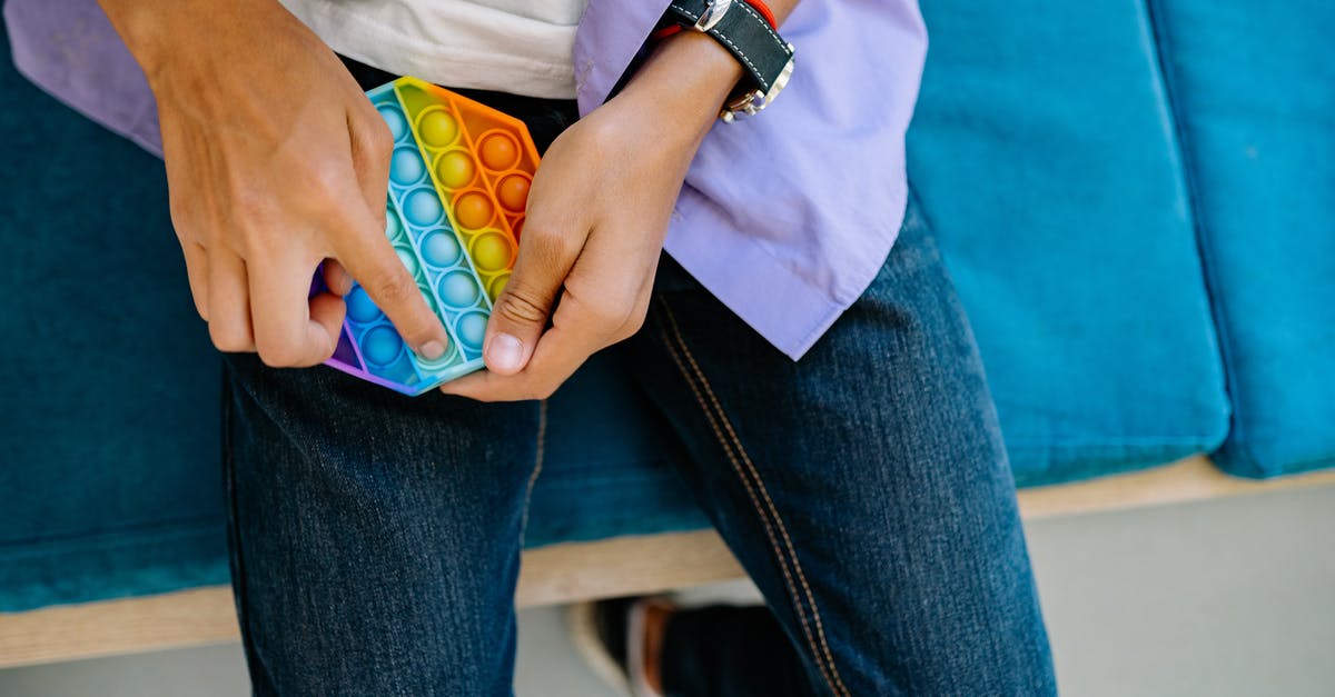 When should consume(+) not be played? - Person in Blue Denim Jeans Holding Colorful Pop It When should consume(+) not be played? - Person in Blue Denim Jeans Holding Colorful Pop It