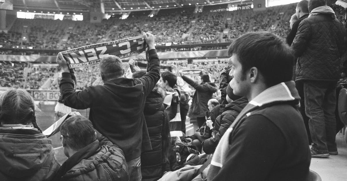 When should I perform the inclination matching maneuver? - Black and white of group of people in warm clothing standing at stadium and watching match When should I perform the inclination matching maneuver? - Black and white of group of people in warm clothing standing at stadium and watching match