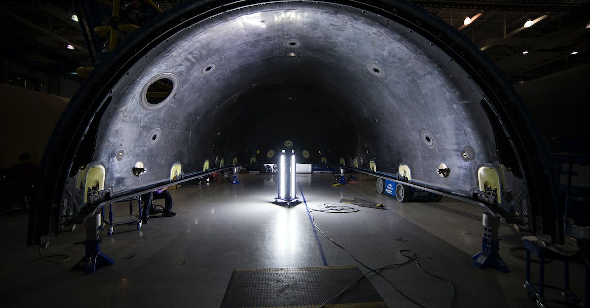 Where are all of the missile max upgrades? - Illuminated tunnel with rocket construction equipment and lights in dark contemporary spacious industrial factory