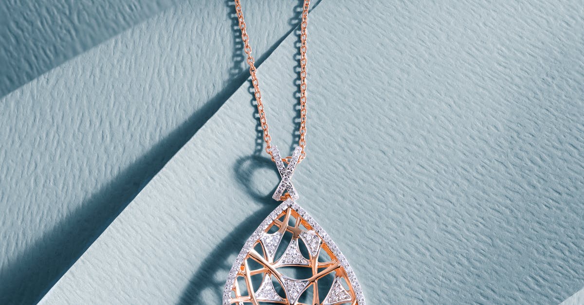 Where are all the diamonds? - Gold and Black Round Pendant Necklace