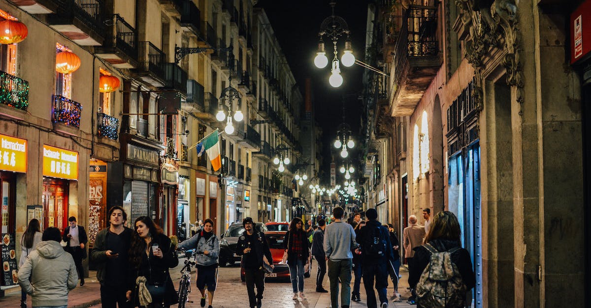 Where are the Life shops located? - Group of People Near Buildings