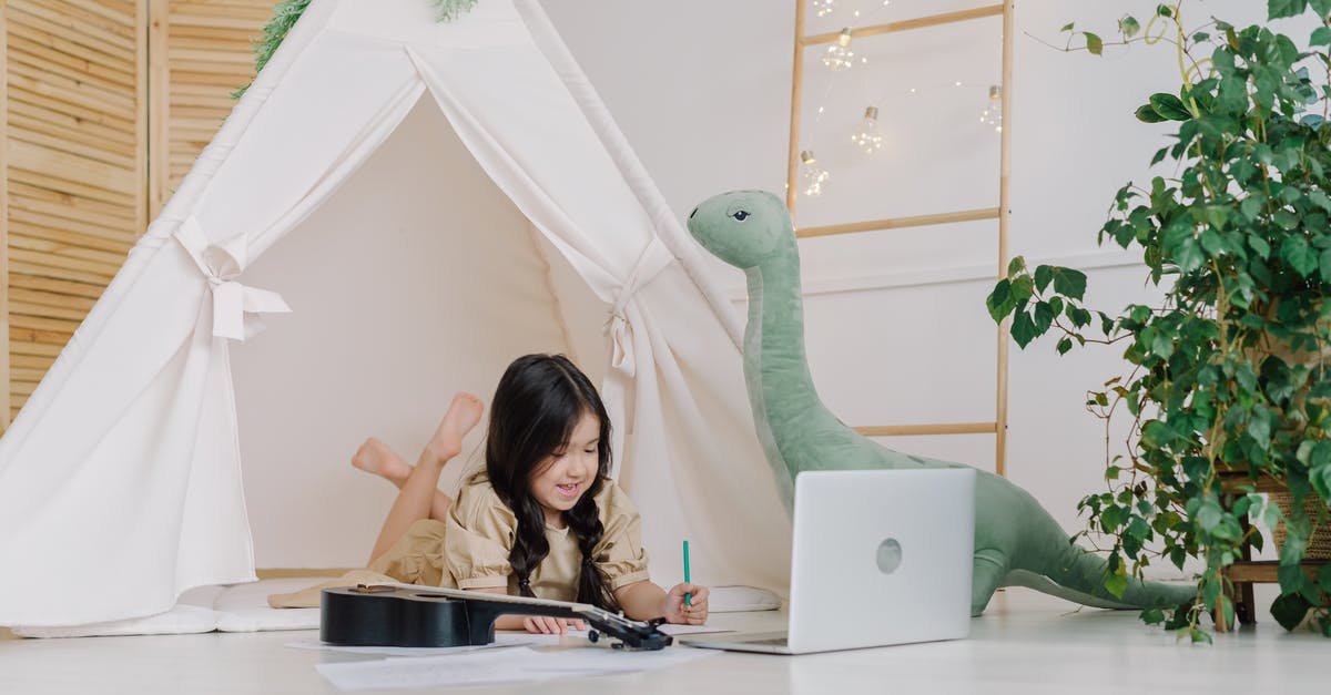 Where are the toys? - Woman in Green Long Sleeve Shirt Using Macbook Where are the toys? - Woman in Green Long Sleeve Shirt Using Macbook