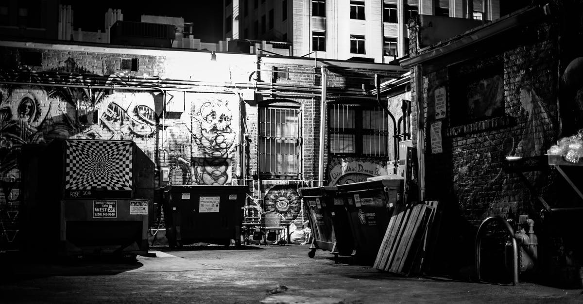 Where can I find a brick? - Shabby district of town with brick buildings with graffiti
