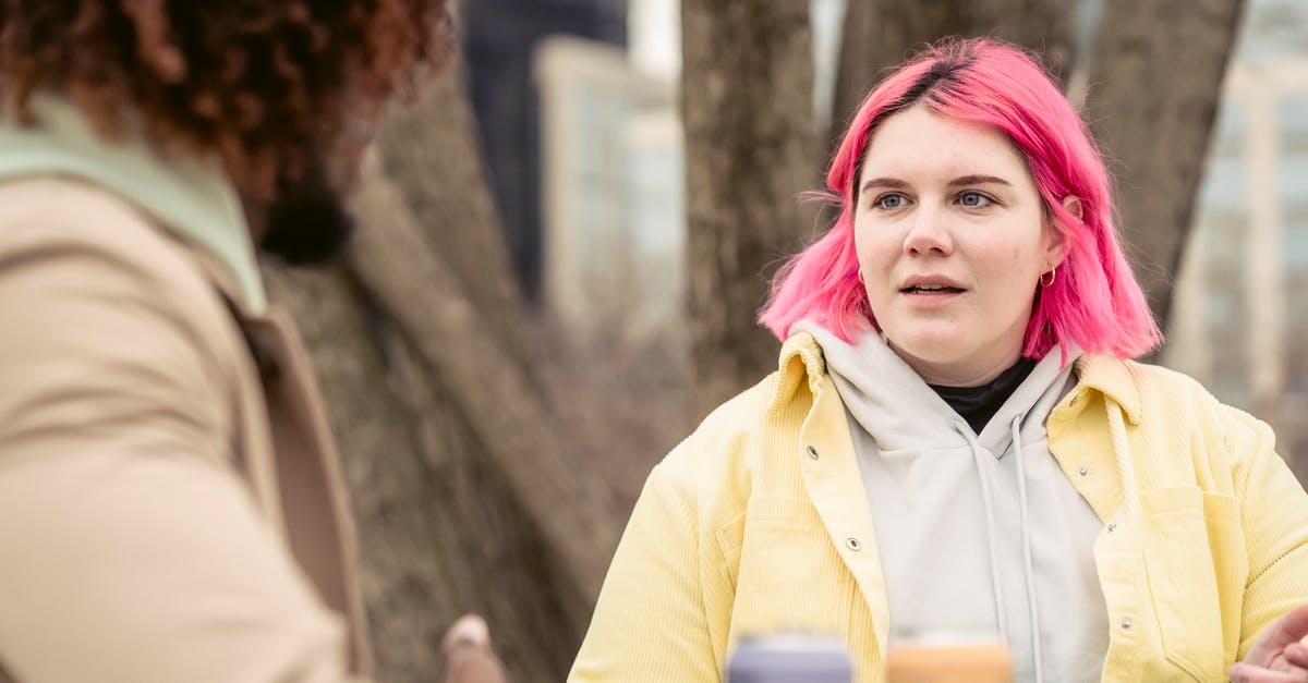 Where can I find monster hair? - Woman speaking with faceless black man in park