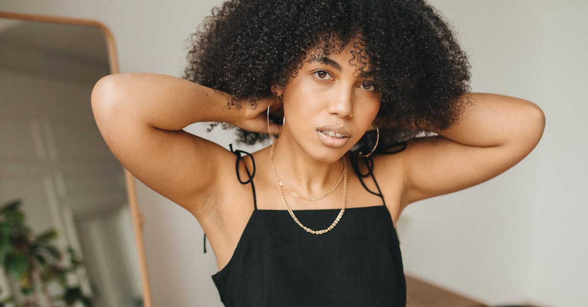 Where can I get a pretty dress? - Woman in Black Dress Wearing Her Necklace