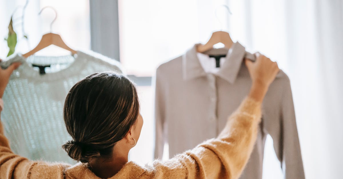Where do I buy power specific outfit? - Anonymous woman choosing clothes in store Where do I buy power specific outfit? - Anonymous woman choosing clothes in store